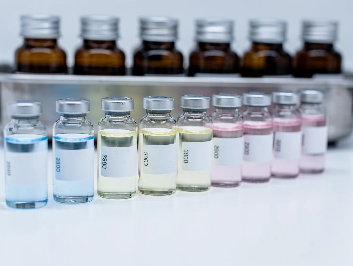 Borosilicate amber vials in cryogenic storage under precision laboratory lighting